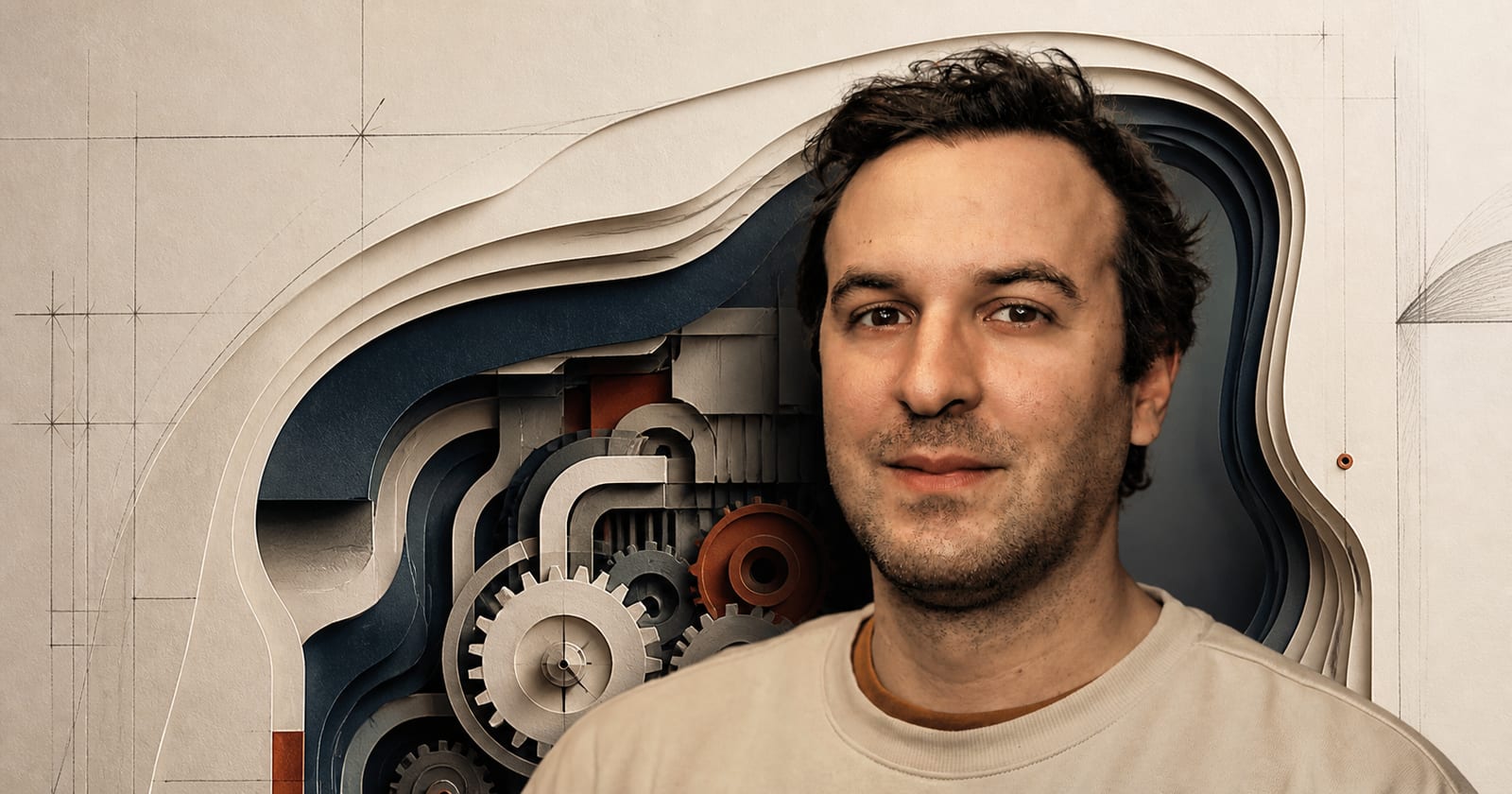 Cenk Kalpakoglu beside a layered paper cutaway of gears, channels, and precise construction lines